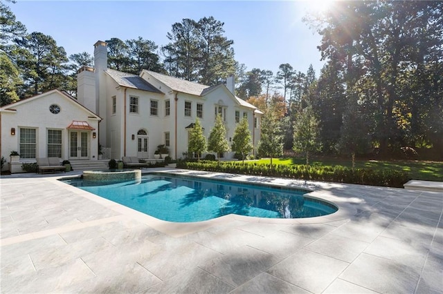 view of swimming pool with a patio area