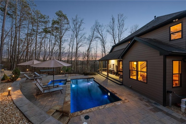 outdoor pool featuring a patio area