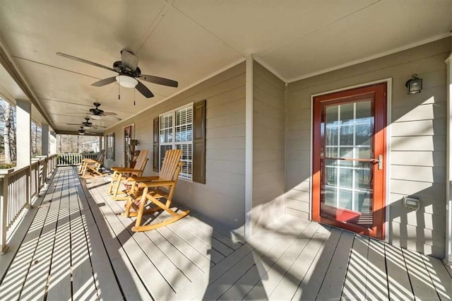 deck with ceiling fan and a porch