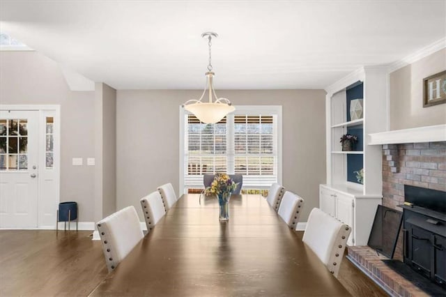 dining area featuring dark wood-type flooring