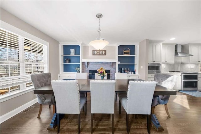 dining space with dark wood-type flooring