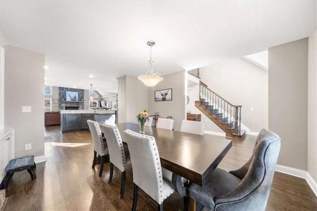 dining space featuring dark hardwood / wood-style flooring