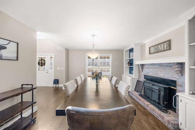 dining room with hardwood / wood-style floors and built in features