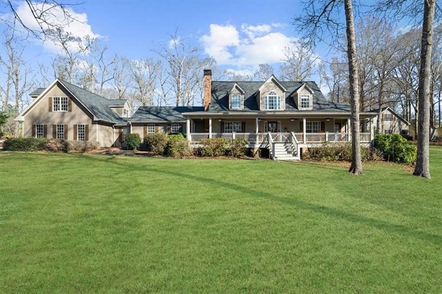 view of front facade with covered porch and a front lawn