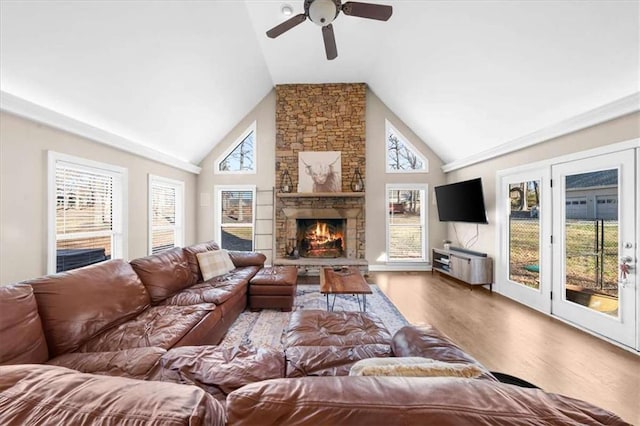 living room with a fireplace, high vaulted ceiling, ceiling fan, and hardwood / wood-style floors