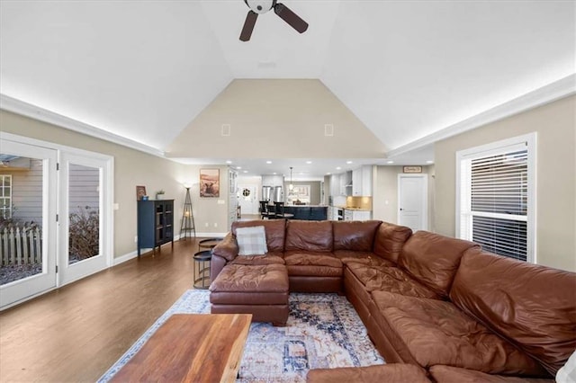 living room featuring high vaulted ceiling, ceiling fan, and wood-type flooring