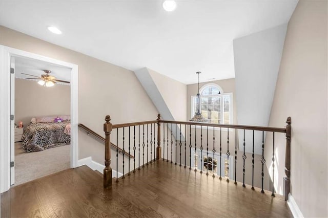 corridor with hardwood / wood-style floors