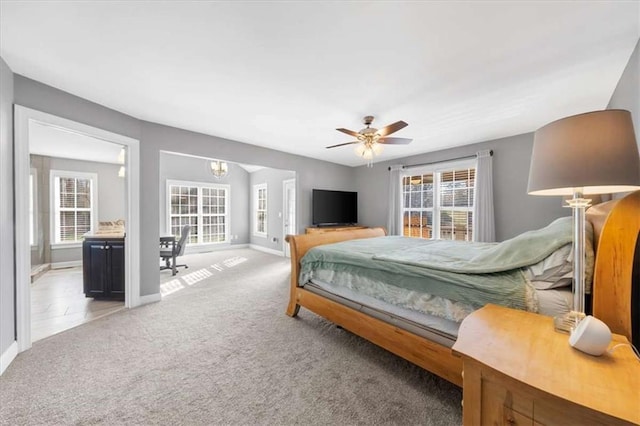 carpeted bedroom with ceiling fan