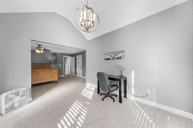 carpeted home office featuring high vaulted ceiling and a chandelier