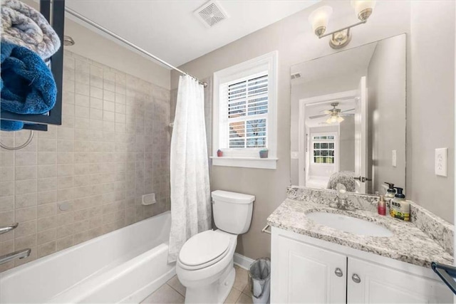 full bathroom with tile patterned floors, toilet, ceiling fan, shower / tub combo with curtain, and vanity