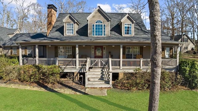 view of front of home featuring covered porch and a front lawn