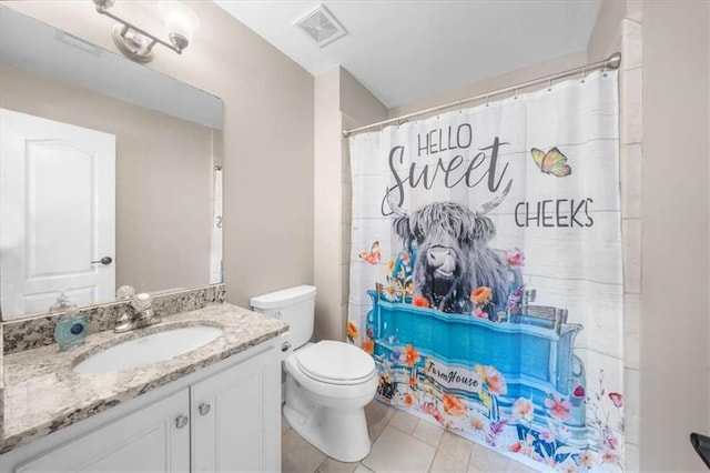 bathroom featuring toilet, tile patterned flooring, curtained shower, and vanity