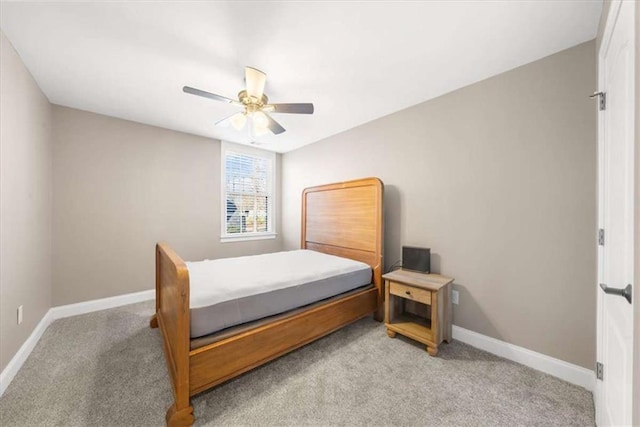 bedroom featuring ceiling fan and light colored carpet