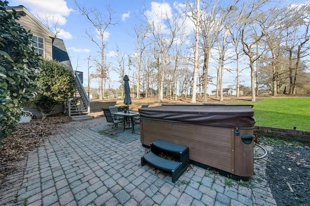 view of patio / terrace with a hot tub