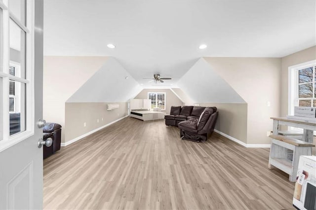 sitting room with lofted ceiling and light hardwood / wood-style flooring