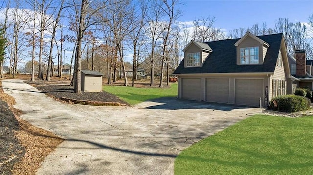 view of home's exterior featuring a garage and a yard