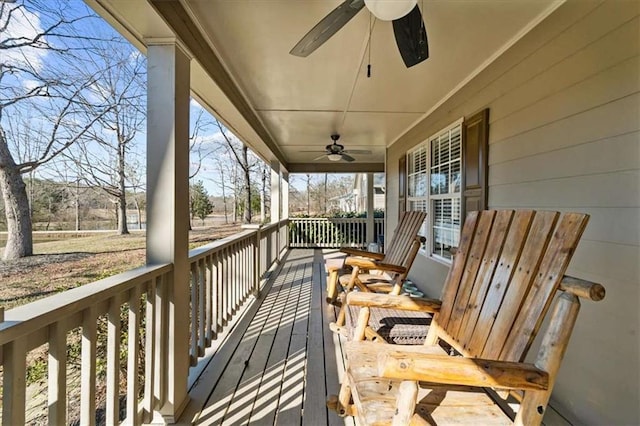 balcony with ceiling fan and a porch