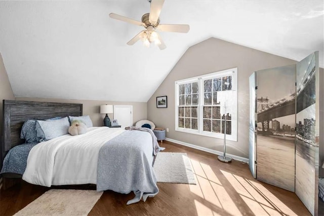 bedroom featuring hardwood / wood-style flooring, ceiling fan, and vaulted ceiling