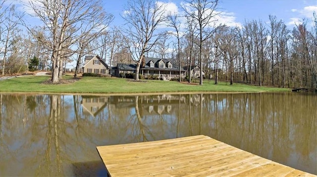 dock area featuring a yard and a water view