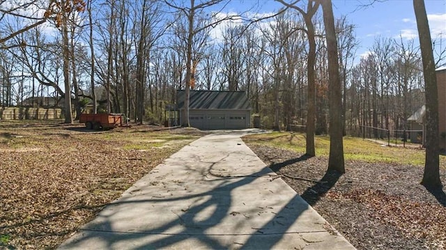 view of front of house with a garage and an outdoor structure