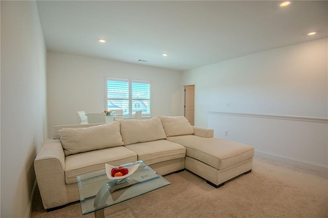 living area featuring baseboards, carpet floors, visible vents, and recessed lighting