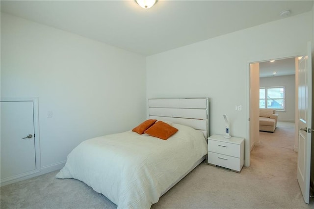 bedroom with light carpet