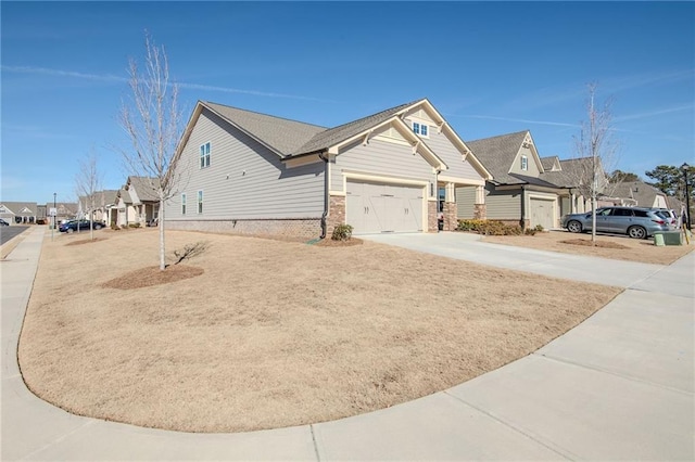 view of side of property featuring a residential view and driveway