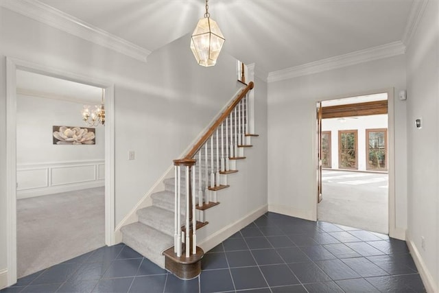 stairway featuring carpet floors and crown molding