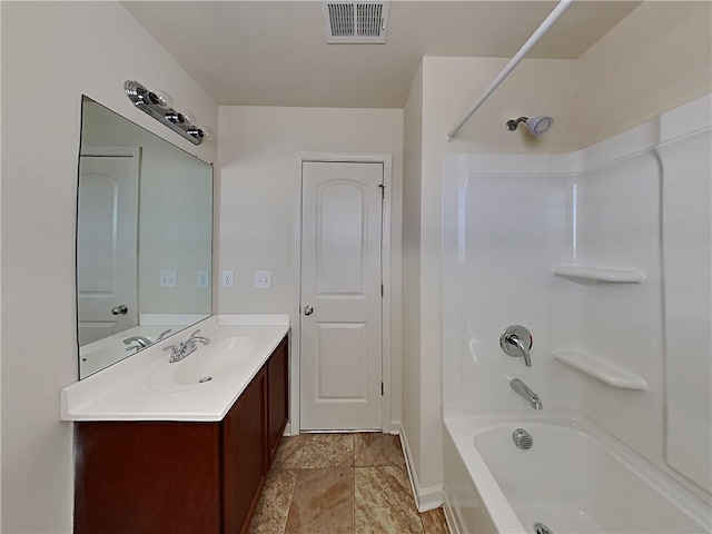 bathroom featuring vanity and shower / tub combination