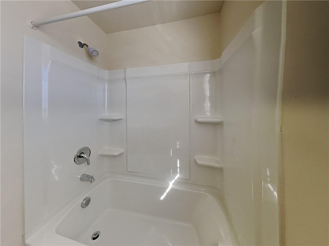 bathroom featuring  shower combination