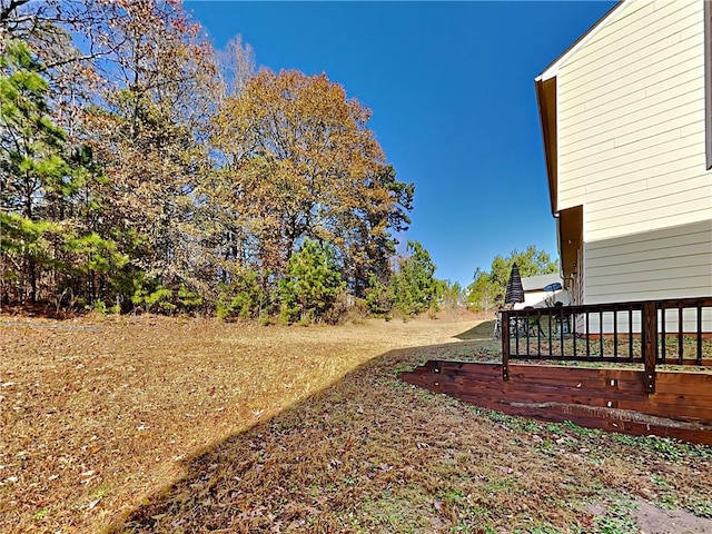 view of yard with a wooden deck