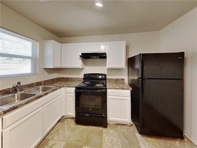 kitchen featuring sink, black appliances, and white cabinetry