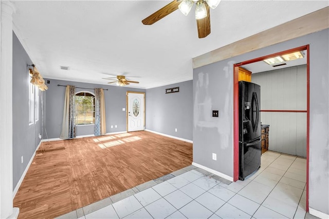 empty room featuring light hardwood / wood-style flooring and ceiling fan