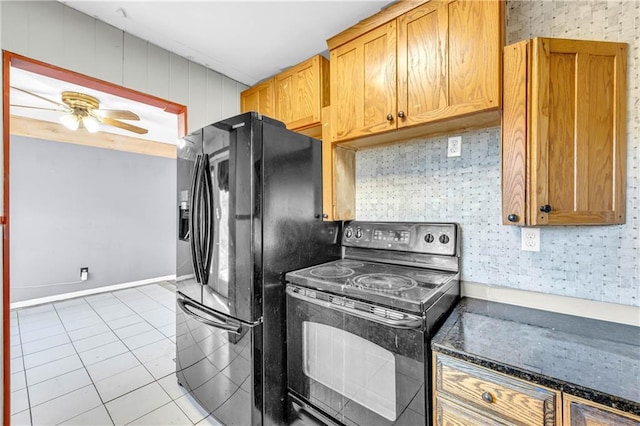 kitchen featuring light tile patterned flooring, ceiling fan, and black appliances