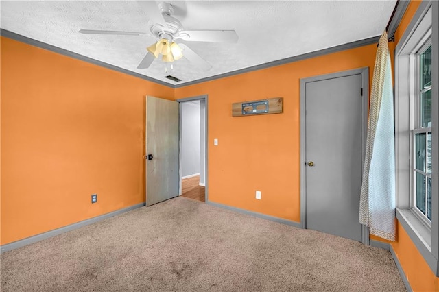 unfurnished bedroom with carpet flooring and ceiling fan