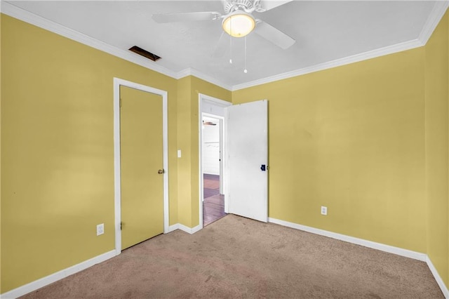 unfurnished bedroom with light carpet, crown molding, and ceiling fan