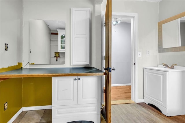 interior space featuring sink and light wood-type flooring