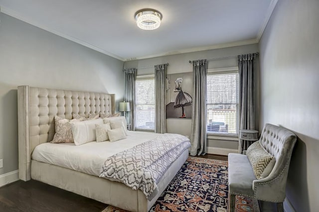 bedroom featuring baseboards, multiple windows, dark wood-style flooring, and crown molding