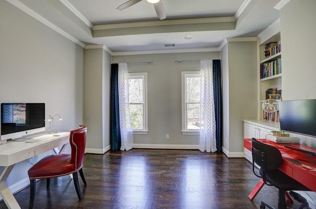 office with a tray ceiling, dark wood-style floors, and ornamental molding