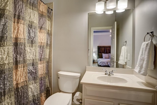 full bathroom with toilet, curtained shower, vanity, and ensuite bathroom