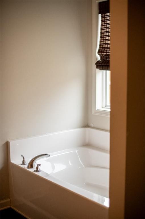 bathroom featuring a bath
