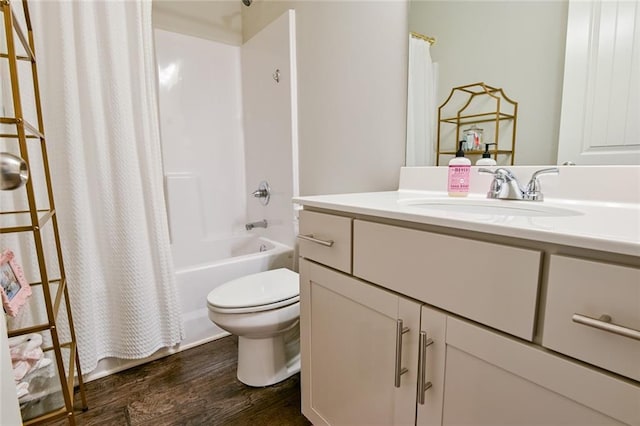 full bathroom featuring wood finished floors, toilet, vanity, and shower / tub combo with curtain