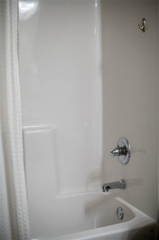 full bathroom with shower / bath combination with curtain