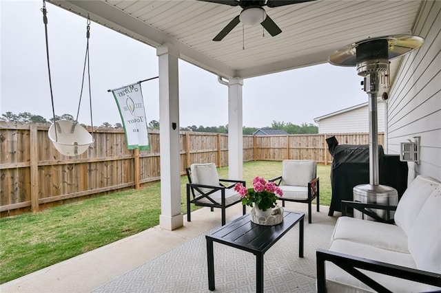 view of patio with a ceiling fan and an outdoor living space