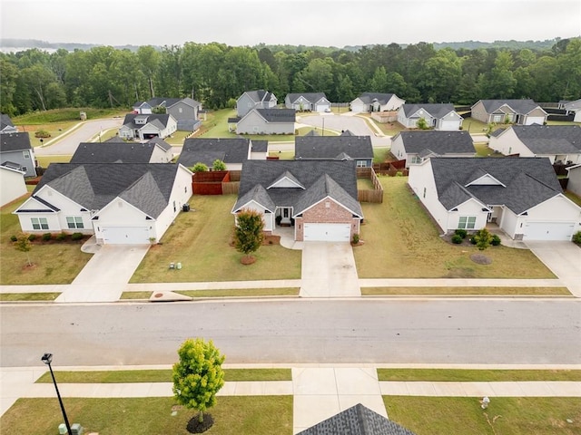 aerial perspective of suburban area with a forest