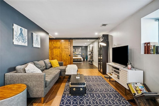 3048 Briarcliff Rd NE Unit 9, Atlanta, GA 30329 - living room with wood finished floors, recessed lighting, and a barn door