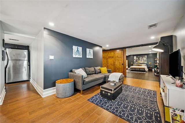 3048 Briarcliff Rd NE Unit 9, Atlanta, GA 30329 - living area featuring wood finished floors and recessed lighting