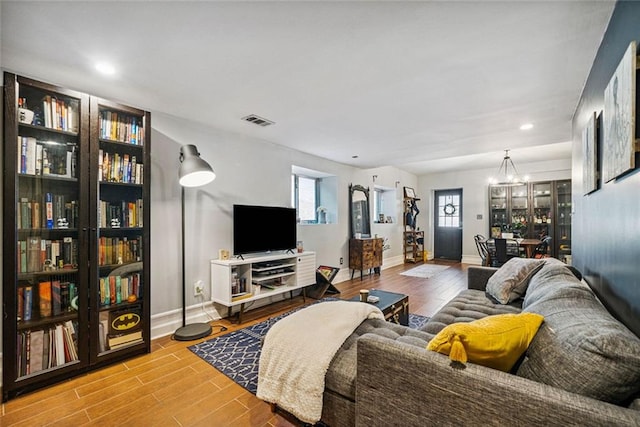 3048 Briarcliff Rd NE Unit 9, Atlanta, GA 30329 - living area with a chandelier, wood finished floors, and recessed lighting