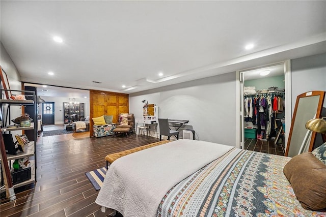 3048 Briarcliff Rd NE Unit 9, Atlanta, GA 30329 - bedroom featuring recessed lighting, wood finished floors, a spacious closet, and a chandelier