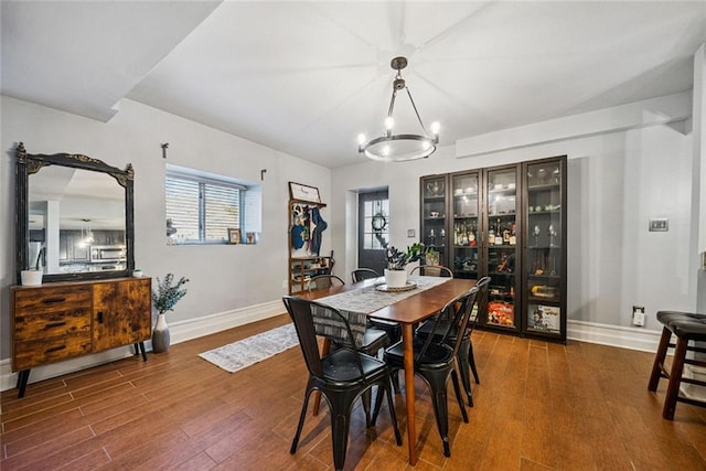3048 Briarcliff Rd NE Unit 9, Atlanta, GA 30329 - dining room featuring wood finished floors and a chandelier